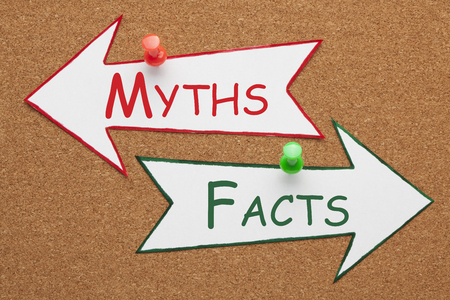 Facts and Myths words on paper arrow pinned on cork board. Change Your Mind. Business Conceptの写真素材