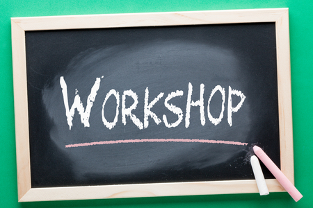 Workshop written on blackboard and color chalks. Education concept.の写真素材