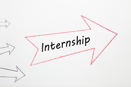 Internship written on red arrow direction sign with black arrows on white background. Business Conceptの写真素材