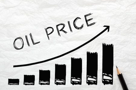 Oil Price with directional arrow written on wrinkled lined paper. Diagram in the shape of a staircase, financial concept.の写真素材