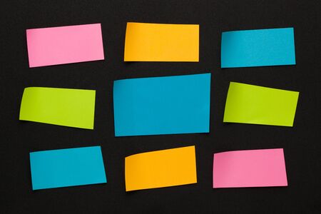 Colorful stickers on black background. Space for text.の写真素材