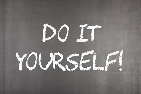 Do It Yourself written on blackboard. Business concept.の写真素材
