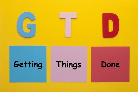 Acronym of GTD for Getting Things Done written on a note.の写真素材