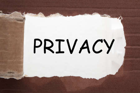 Privacy text under torn paper. Business conceptの写真素材