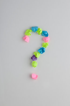 Question mark made with colorful crumpled papers. Concept of finding idea