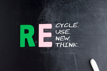 Recycle, reuse, renew and rethink written in chalk on a blackboard. Getting serious about recycling means starting with truly recyclable productsの写真素材