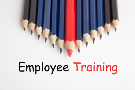Employee training concept with red pencil standing out from the crowd as leader. Adult educationの写真素材