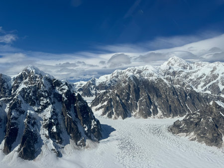 The Ruth Glacier sweeps down from Mount Denali, the tallest mountain in North America. The jagged granite ridgesの写真素材