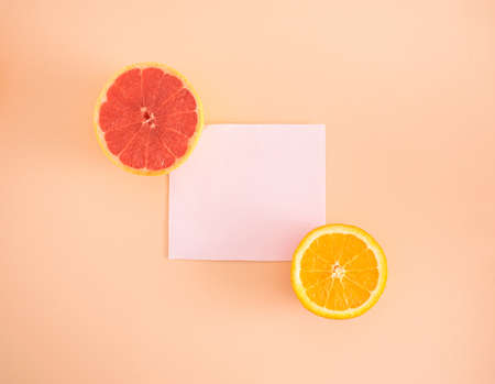 Fresh grape and lemon fruits on pastel background with copy space. Creative minimal concept. Flat lay.の写真素材