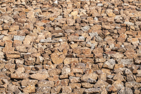Texture bacground of wall builded from stone - rubble.