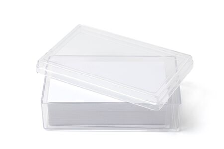 Open transparent plastic box holder with blank visit cards on white. の写真素材
