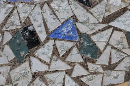 Mosaic of pieces of different shapes of colored glass