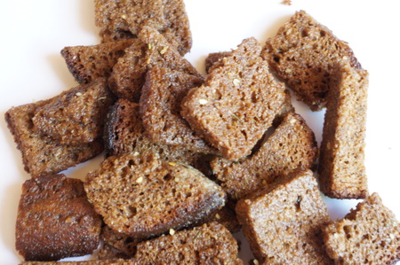 toasted garlic croutons from rye bread on white background