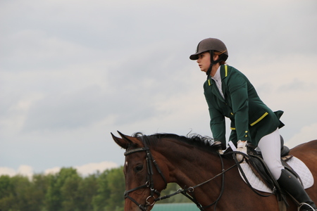 Medvedev, RUSSIA, AUGUST 26, 2017: Open championship on horse racing and jumping devoted to the day of the settlement of Medvedev - show-jumping- jumping over an obstacleのeditorial素材