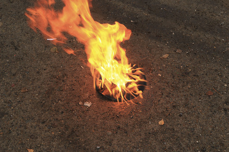 The old vinyl black plate is embraced by a bright strong flameの写真素材