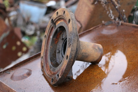 old abandoned rusty machine tool in non-working condition, half disassembled