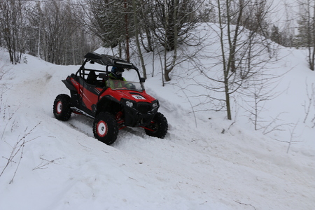 KAZAN, RUSSIA - DECEMBER 23, 2017: Opening of the Winter Season in Kazan Ring Canyon - Free open auto show - presentation and off-road racing - snow-covered forest track - on off-road cars and ATVsのeditorial素材