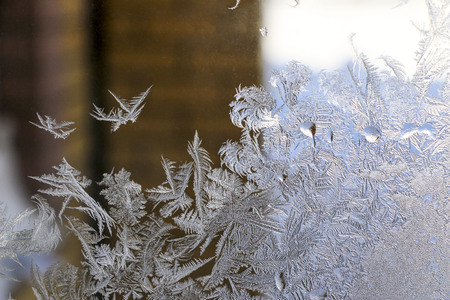 Beautiful  ice pattern on window in winter. fabulous Frosty winter pattern at  glass.の写真素材