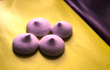 delicate airy meringue on a yellow background.