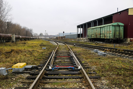 railway in the industrial zone.empty rails with  semaphore, in anticipation of  freight train.の写真素材
