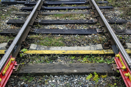 railway in the industrial zone.empty rails with  semaphore, in anticipation of  freight train.