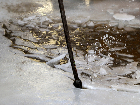 iron ice pick break  ice to drain  water in  spring during thaw and flood.の写真素材