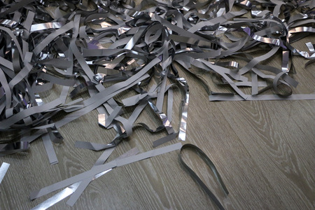 silver strips of foil and paper after a children's paper show.