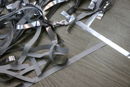 silver strips of foil and paper after a children's paper show.