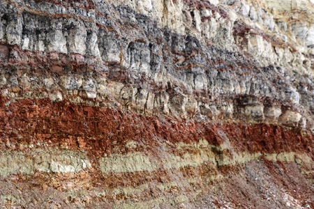 the texture of different layers of clay underground in a clay quarry after geological study of the soil.の写真素材