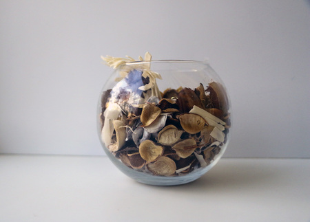 natural flavoring for indoor. glass vase with a mixture of aromatic herbs, dried fruit and spices.の写真素材