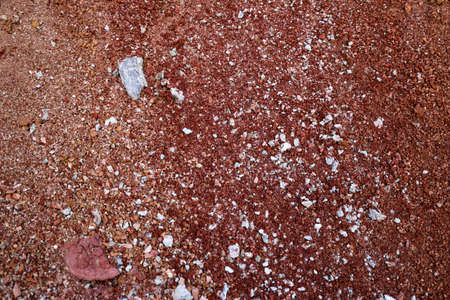 textures of various clay layers underground in clay quarry after geological study of soil. colored layers of clay and stone in section of earth, different rock formations and soil layers.の写真素材