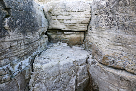 mountain textures of stones with interlayers of gypsum, colored quartz, clay, sand and other layers...