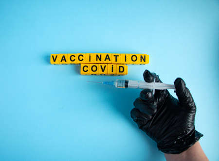 Various medicines on a blue background for Vaccination against Corona Virus. Concept of fight...