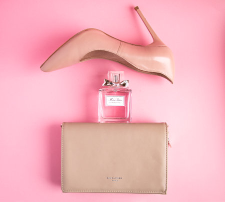 YOSHKAR-OLA, RUSSIA, JANUARY 29, 20201: glass bottle with delicate luxury perfume Miss Dior on a pink background.のeditorial素材