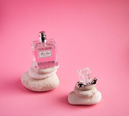 YOSHKAR-OLA, RUSSIA, JANUARY 29, 20201: glass bottle with delicate luxury perfume Miss Dior on a pink background.のeditorial素材