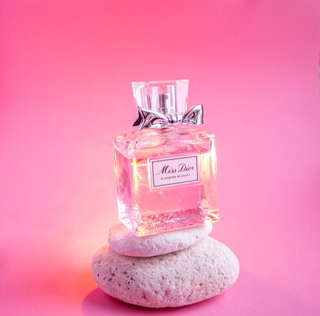 YOSHKAR-OLA, RUSSIA, JANUARY 29, 20201: glass bottle with delicate luxury perfume Miss Dior on a pink background.のeditorial素材