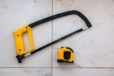 saw and cut parts with a jigsaw. the process of cutting various metal parts with a hand jigsaw using...