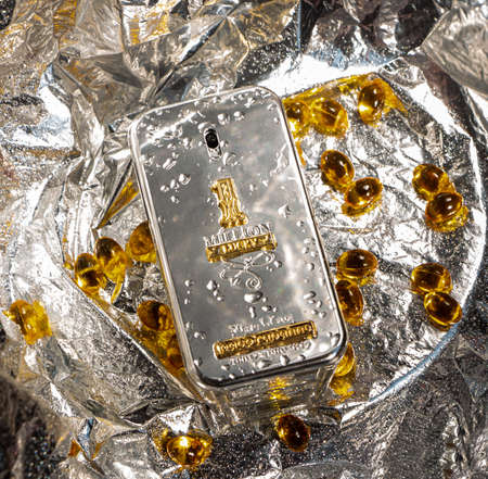 YOSHKAR-OLA, RUSSIA, AUGUST 20, 2021: Cuddling and powerful men's perfume in the silver gold bottle of Paco Rabanne 1 Million.のeditorial素材