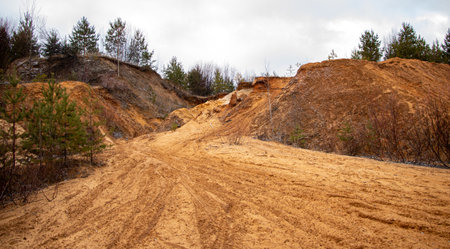 Textural sand, with a relief surface, multi-colored layers and different in size of granules, in an...