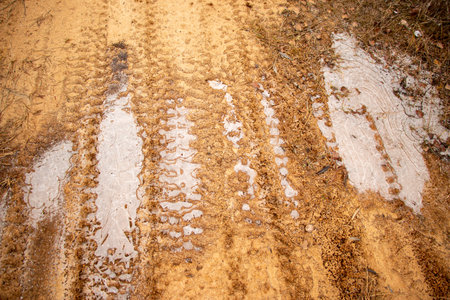 Textural sand, with a relief surface, multi-colored layers and different in size of granules, in an outdoor sand career, after mining ore and sand for construction.の写真素材