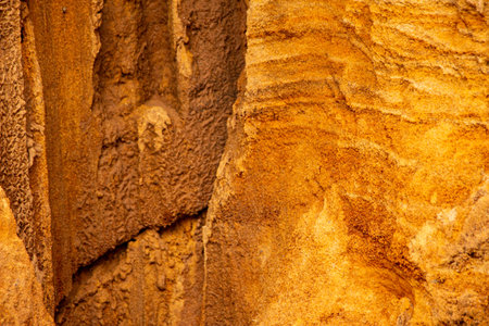 Textural sand, with a relief surface, multi-colored layers and different in size of granules, in an...