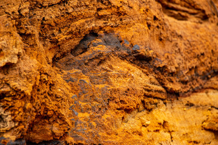 Textural sand, with a relief surface, multi-colored layers and different in size of granules, in an...
