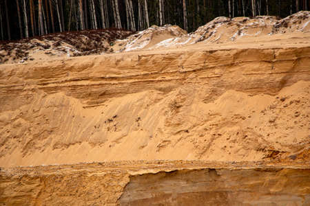 Textural sand, with a relief surface, multi-colored layers and different in size of granules, in an...