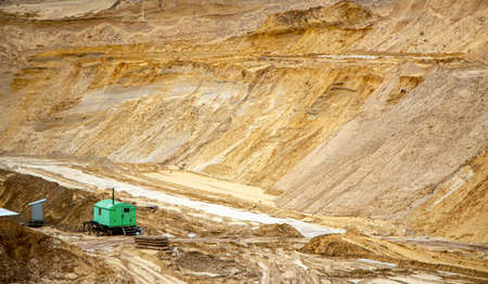 Textural sand, with a relief surface, multi-colored layers and different in size of granules, in an outdoor sand career, after mining ore and sand for construction.の写真素材