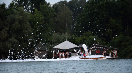 Belgrade, Serbia. June 26th 2016 - Foam party in house on the river during the summer sunsetのeditorial素材