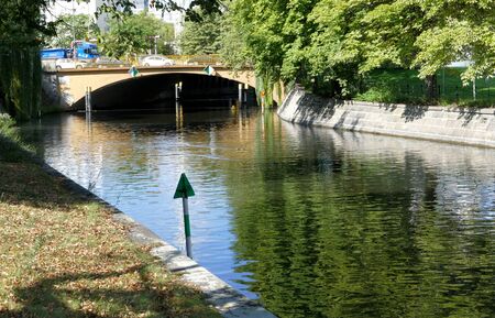 BERLIN, GERMANY. SEPTEMBER 2ND 2016 - Canal in Berlin with trees on sides, building and traffic in backgroundのeditorial素材