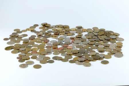 Pile of coin isolated on white backgroundの写真素材