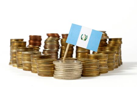 Guatemala flag waving with stack of money coinsの写真素材