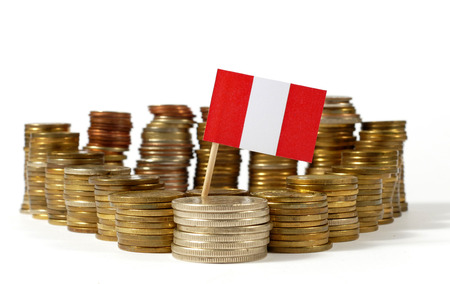 Peru flag waving with stack of money coinsの写真素材