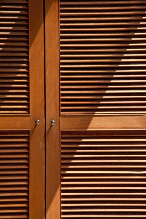 wood jalousie door texture  with lightingの写真素材